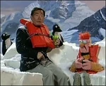 George Takei with Beaker and some Muppet penguins.