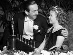 Shirley Temple with Walt Disney with the Oscar that the film Snow White won.