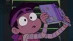 Marco reading Star's journal