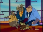 Trader Moe with his goons and Baloo