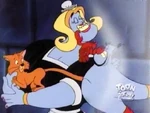 Genie as a French maid with a cat and a guy with a lobster on his nose