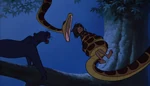 Bagheera is about to smack Kaa's jaw just as he is about to eat Mowgli.