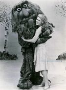 Sweetums hugging Bernadette Peters.