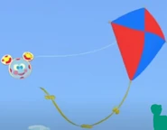 Toodles flying a kite.