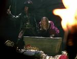 Barbossa and Elizabeth with the treasure.