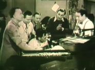 L-R: Pinto Colvig, John Sibley, Penner, Frank Thomas (seated), W. Disney, Kimball.