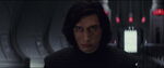 Kylo angrily glares at Snoke in the throne room.