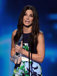 Sandra Bullock speaks onstage during the 2014 Peoples' Choice Awards.