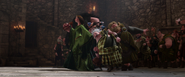 Lord Macintosh, King Fergus, and the other Lords having their ears pulled like schoolboys by Queen Elinor to stop the fight