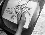 A production photo of Marc Davis creating a sketch of Maleficent.