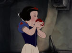 Snow White bites the apple.