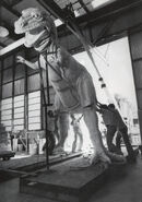 Imagineers assembling the T. Rex from World of Energy