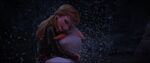 Anna embracing Olaf before he fades away.