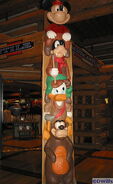 Humphrey with Mickey, Donald and Goofy on a totem pole at Disney's Wilderness Lodge