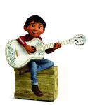 Miguel playing the guitar