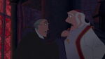 Frollo defying The Archdeacon and about to tosses him aside in defiance.