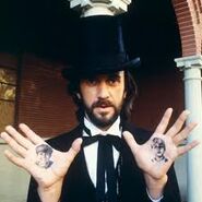 Mr. Dark with tattoos of Jim Nightshade and Will Halloway on his palms