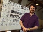 Joe Ranft in front of his storyboards for The Nightmare Before Christmas.