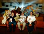 Promotional image of the Black Cauldron cast posing with the directors