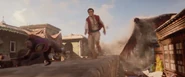 Giant Iago chases Aladdin through the streets of Agrabah.