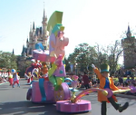 The Hatter pulling a float of himself and March Hare at the Happiness is Here Parade