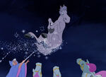 Cinderella's Fairy Godmother using magic on Cinderella's horse.