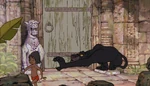 Bagheera tries to grab Mowgli