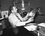 Disney examining the production artwork for Cinderella, c. 1949.