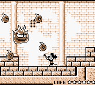 Mickey has a boss battle with a giant fireball surrounded by smaller fireballs