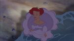 Ariel putting her feet in seawater