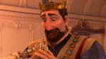 King Frederick putting the princess's crown on baby Rapunzel's head