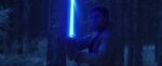 Finn wielding the Skywalker lightsaber.