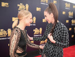 Kristen Bell and Alison Brie attending the 2018 MTV Movie and TV Awards.