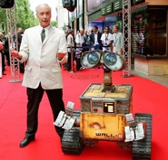 Ben Burtt standing next to a WALL-E statue at the film's premiere in June 2008.