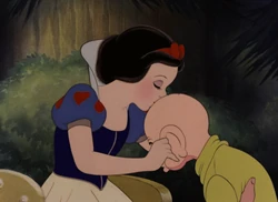 Dopey gets a goodbye kiss from Snow White.