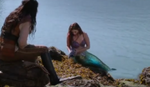 Ariel reveals more of her tail as she goes through her collection of recently-found treasures