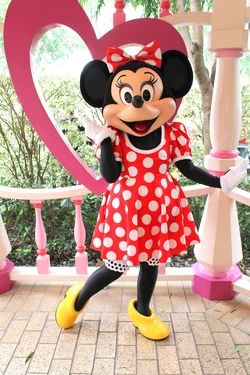 Minnie, posing for a photo in Disneyland.
