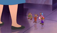 Cinderella standing her leg next to her friends