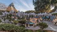 The Matterhorn visible behind Pinocchio's village on Storybook Land Canal Boats