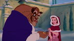 Belle gives Beast some birdseed