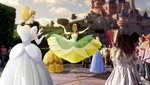 Cinderella watching Princess Tiana's entrance at Disneyland Paris.