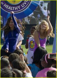 Olivia dancing 'The Platypus Walk' at Disney Magic of Healthy Living Event, with Kelsey Chow