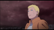 Naruto happily looking at Boruto after Momoshiki is defeated.