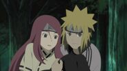 Minato about to carry Kushina back to Konoha.