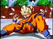 Future Gohan has glass all over him after he is slammed into a window by future 18.