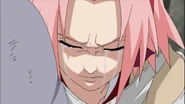 Sakura cries as she can't bring herself to kill the man she loves.