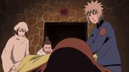 Minato asking Biwako if Kushina is alright while she is having labor pains.