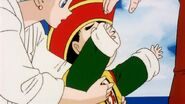 Gohan yelling as Bulma grabs him