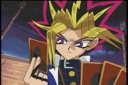 Yami Yugi holding a card