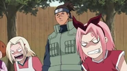 Sakura telling Naruto to stop distracting Sasuke.